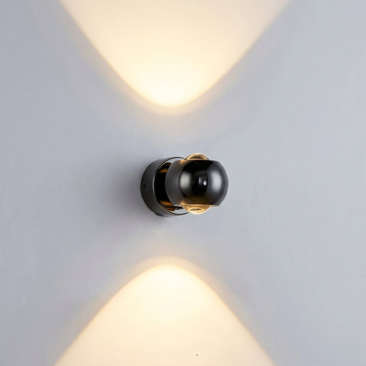Sculptural modern wall sconce in a living room, providing adjustable ambient LED lighting. Contemporary home decor.