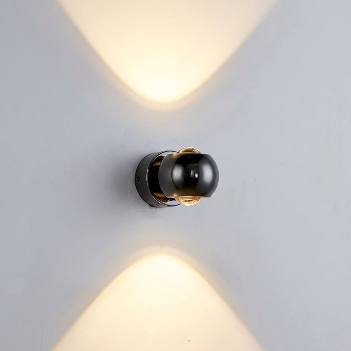 Decorative Glintara wall sconce, a modern LED lighting fixture enhancing home decor with dimmable ambient light.