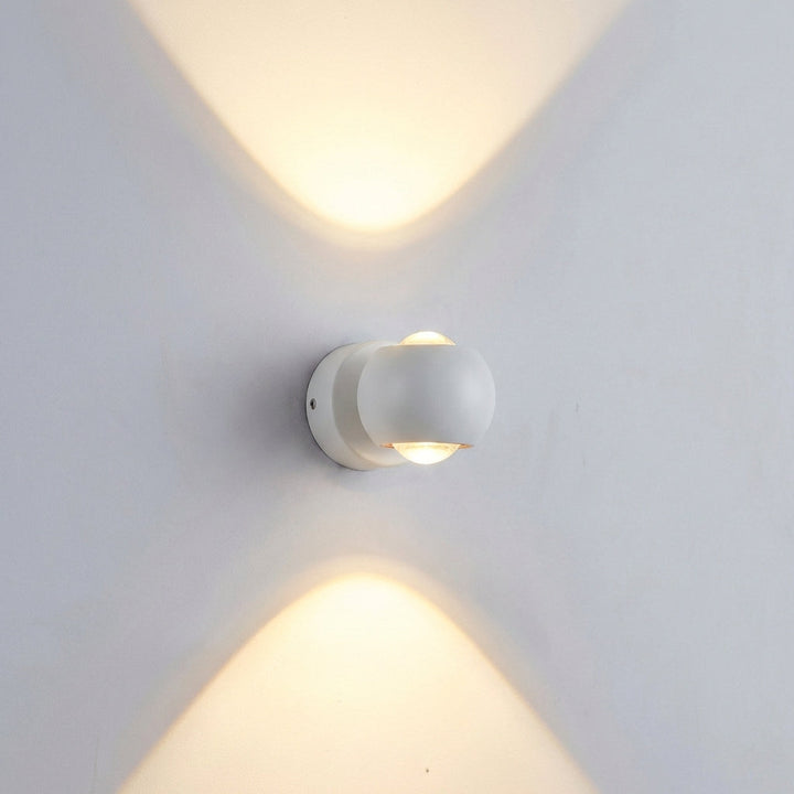 Contemporary Glintara wall lamp, adjustable modern LED fixture for indoor ambient lighting in a stylish setting.
