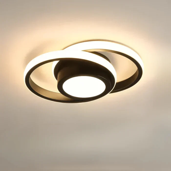 Bright modern LED dual ring ceiling light, Twilight Rings, contemporary design for indoor spaces.
