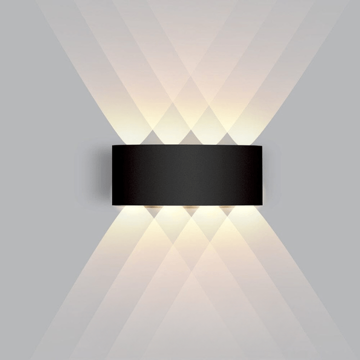 Contemporary LED wall lamp, weatherproof & energy-efficient for exterior.