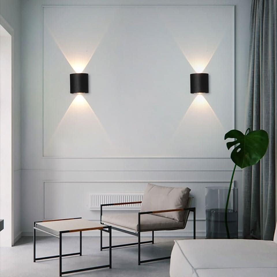 Contemporary LED wall light, weatherproof design for exterior illumination.