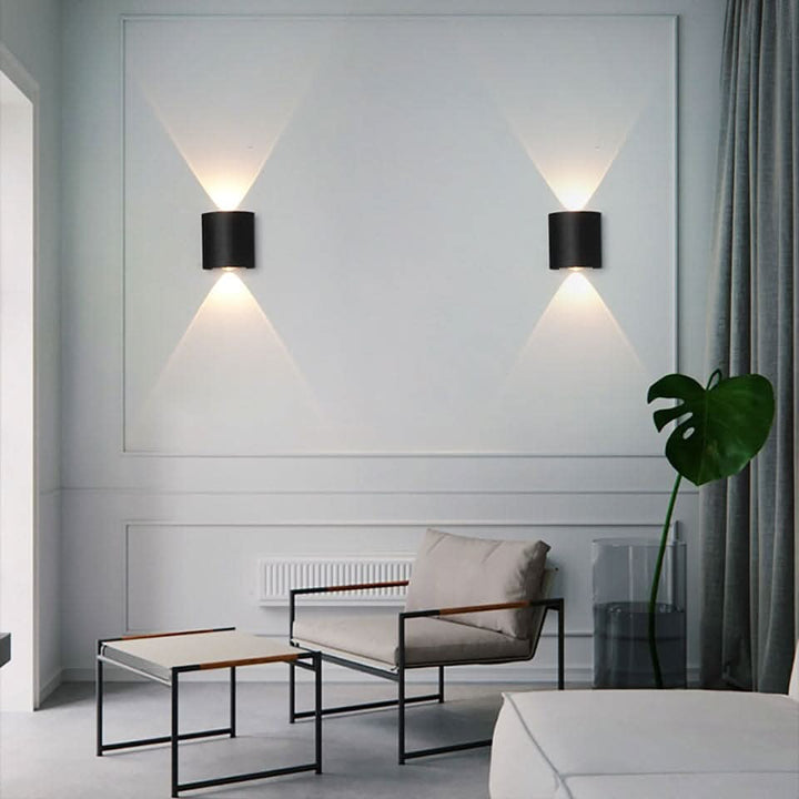 Contemporary LED wall light, weatherproof design for exterior illumination.