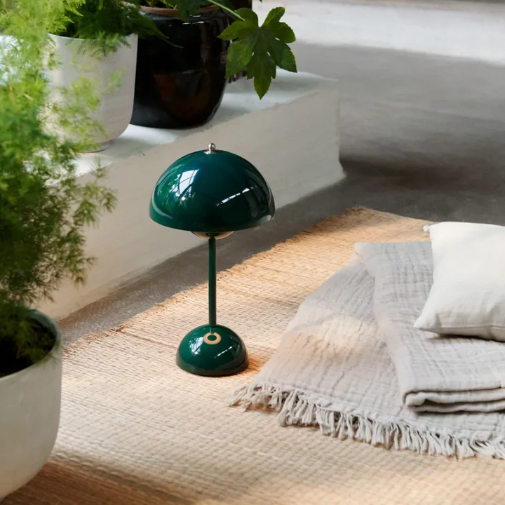 Dimmable touch-sensitive LED table lamp, adjustable brightness for ambient or reading light.