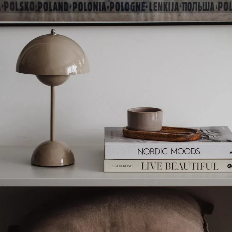 Energy-efficient LED table lamp, modern touch control for bedroom or living room ambiance.