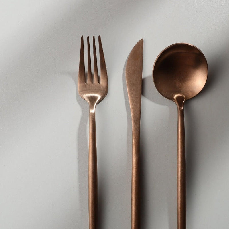Rose gold flatware set for modern dining, perfect for elegant home entertaining.