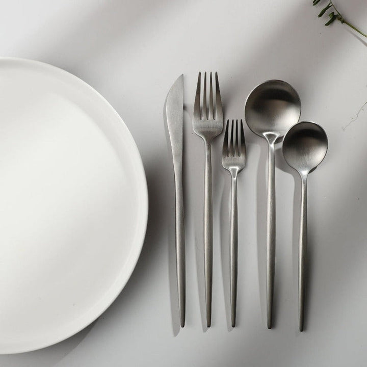 Elegant matte gold minimalist flatware set, perfect for modern kitchen and dining.