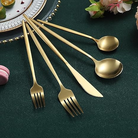 Rose gold flatware set, minimalist design enhancing modern dining tables.