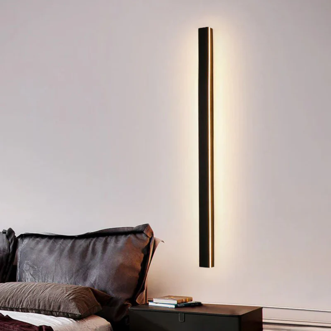 LineaGlow outdoor LED wall lamp, showcasing its slim profile against a textured wall.