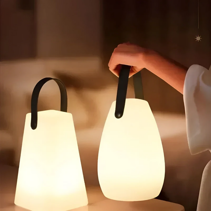 Stylish waterproof wireless lamp, rechargeable for flexible indoor lighting or outdoor ambiance.