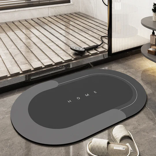 Absorbent oval bathroom floor mat, quick-drying & non-slip for safety & comfort. Stylish modern home essential.