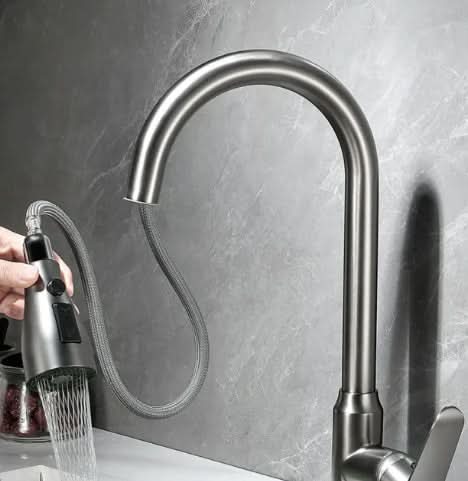 Sleek touch-activated kitchen faucet with pull-out sprayer, a modern upgrade for a functional & stylish kitchen.