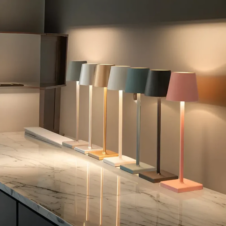 Contemporary wireless LED table lamp, dimmable with touch control, adds modern flair & light.