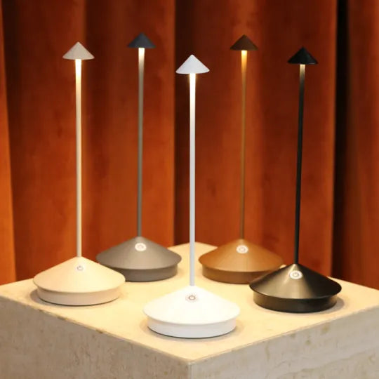 Sleek portable LED accent lamp, rechargeable and cordless for flexible lighting.
