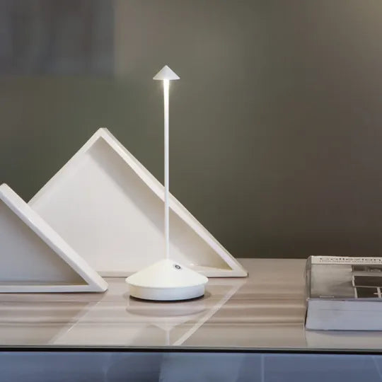 Sleek rechargeable LED table lamp, wireless for convenient portable accent lighting.