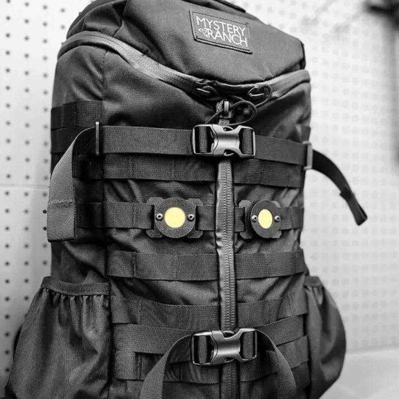 Close-up of Molle insect repellent holder, an essential outdoor accessory for hiking gear