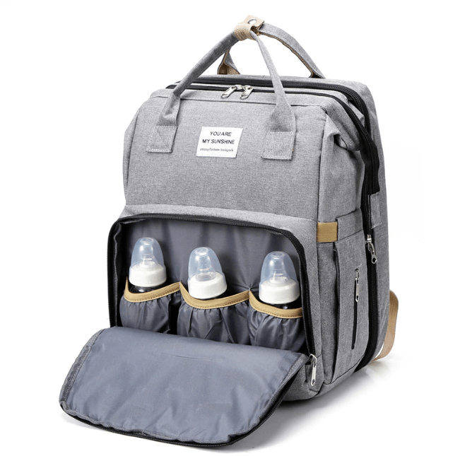 Organized storage in a baby travel backpack with a fold-out portable bed & changing area.