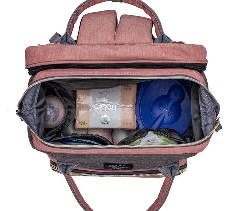 Stylish grey portable baby bed & diaper bag folded as a sleek travel backpack.
