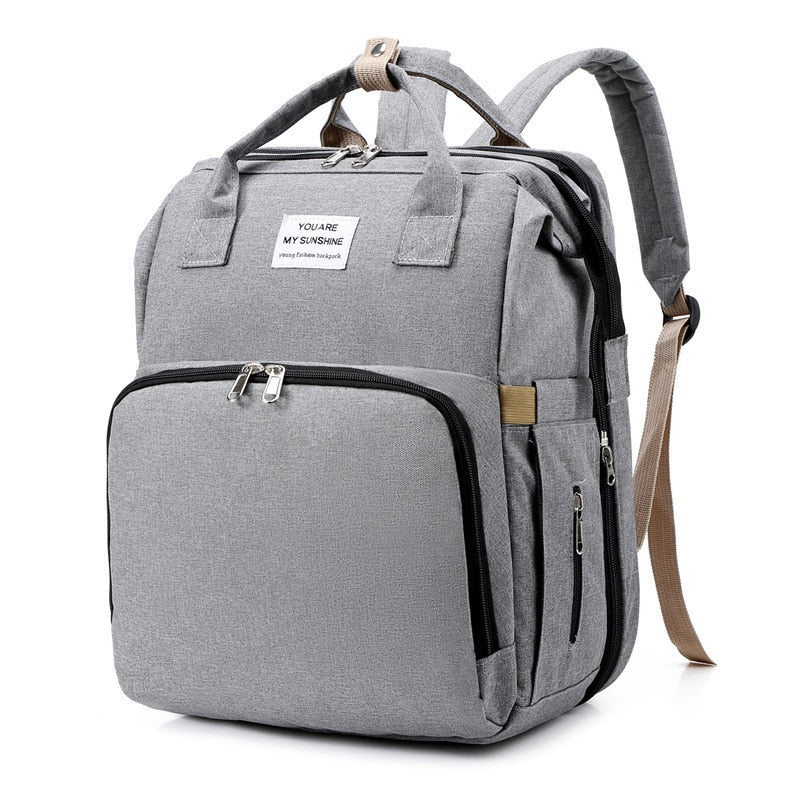 Spacious diaper bag backpack with integrated changing station for baby essentials.