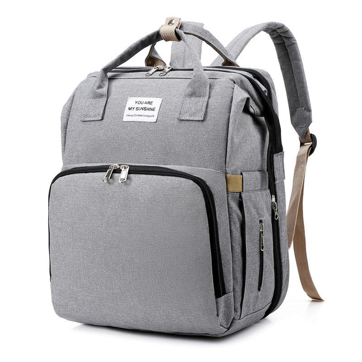Spacious diaper bag backpack with integrated changing station for baby essentials.