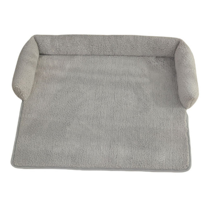 Comfortable pet blanket and dog bed with a soft neck pillow and non-slip bottom. Machine washable pet accessory.