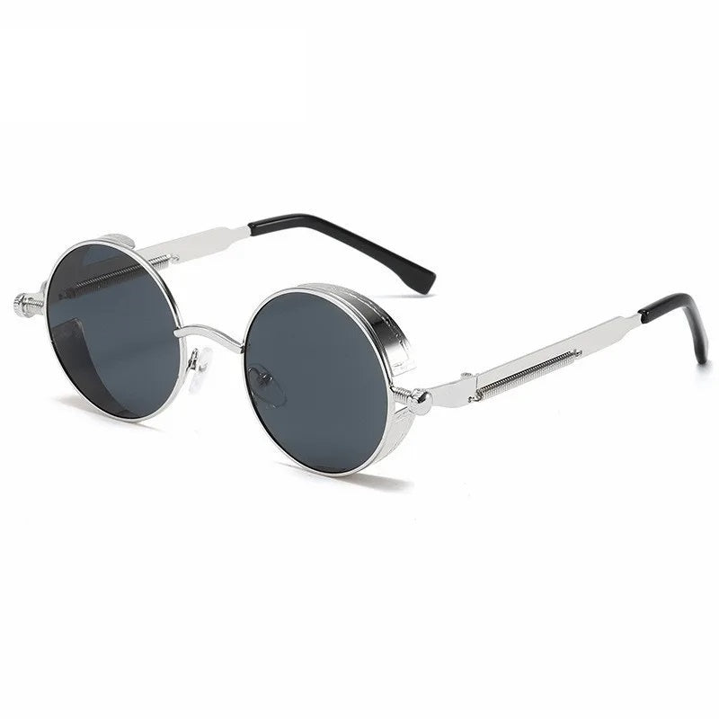 "Occhiali da sole vintage rotondi unisex con montatura robusta, colore nero grigio, protezione UV400, stile senza tempo."