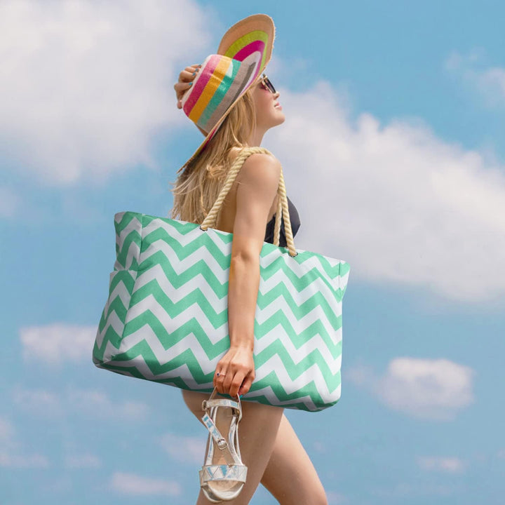 Women's travel bag: durable, waterproof, sandproof, oversized beach tote for convenience.