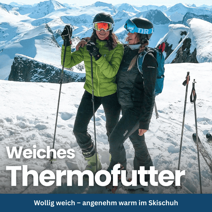 Model wearing black thermal winter ski socks with ski boots, ready for slopes