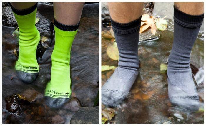 Unisex black waterproof socks for hiking and winter sports, against a plain background.
