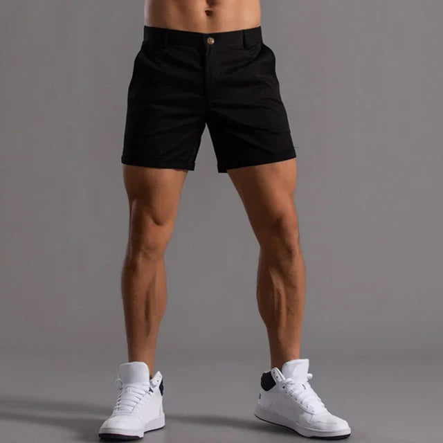 "Pantaloncini estivi uomo comodi, leggeri, in tessuto traspirante, taglio versatile, colore grigio, su sfondo bianco"