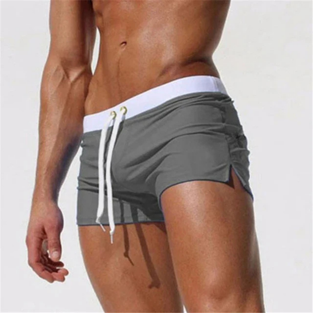 "Pantaloncini mare uomo asciugatura rapida, vari colori vivaci, piscina o spiaggia, design moderno e confortevole."