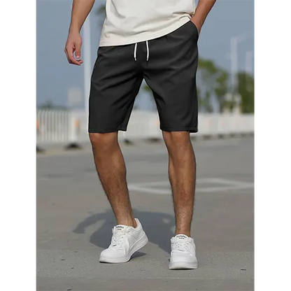 "Pantaloncini uomo vita alta blu navy traspiranti, adatti per l'estate, con design aderente e stile moderno."