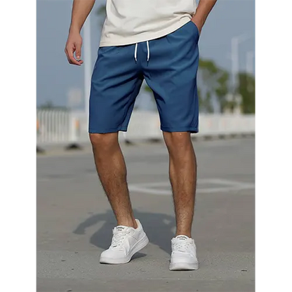 "Pantaloncini uomo vita alta blu navy traspiranti, adatti per l'estate, con design aderente e stile moderno."