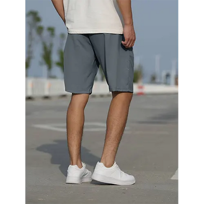 "Pantaloncini uomo vita alta blu navy traspiranti, adatti per l'estate, con design aderente e stile moderno."