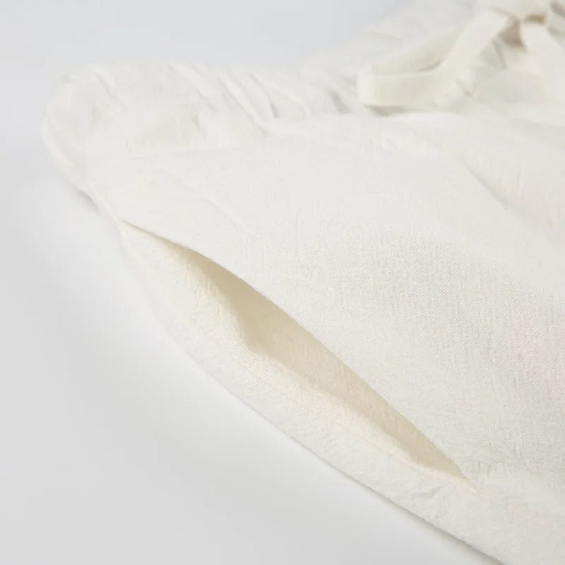 "Pantaloni estivi da donna in lino leggeri, vestibilità rilassata, colore naturale, ideali per look eleganti e freschi."