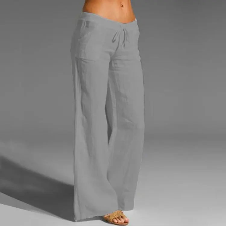 "Pantaloni estivi da donna in lino leggeri, vestibilità rilassata, colore naturale, ideali per look eleganti e freschi."