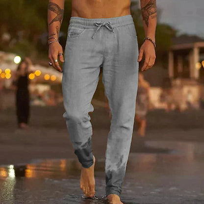 "Pantaloni leggeri in lino da uomo, beige chiaro, eleganti e comodi, ideali per l'estate, con vestibilità rilassata."