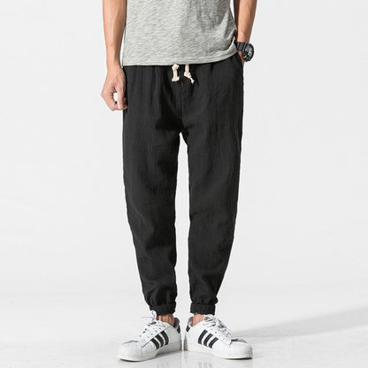 "Pantaloni uomo blu marino in lino e cotone, design elegante con vita elasticizzata e tasche funzionali, versatili e comodi."