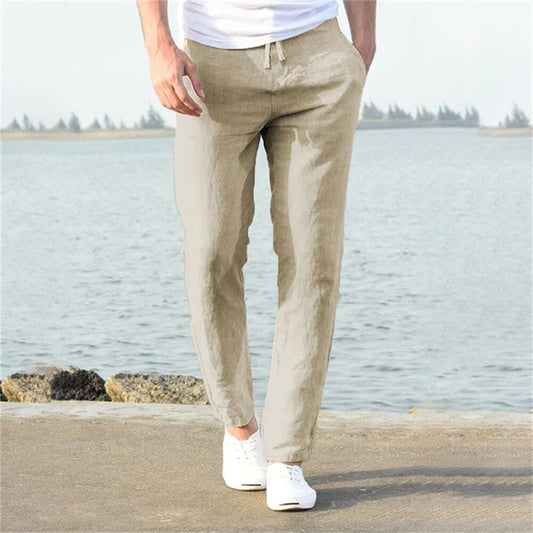 "Pantaloni uomo cotone lino traspirante, vestibilità rilassata, cintura regolabile, tasche, colore blu navy eleganti."