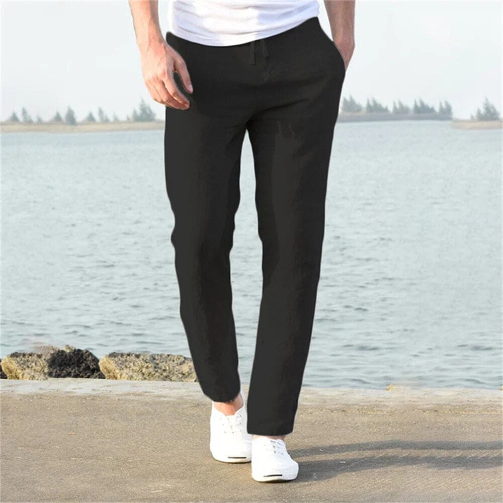 "Pantaloni uomo cotone lino traspirante, vestibilità rilassata, cintura regolabile, tasche, colore blu navy eleganti."