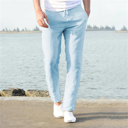 "Pantaloni uomo cotone lino traspirante, vestibilità rilassata, cintura regolabile, tasche, colore blu navy eleganti."