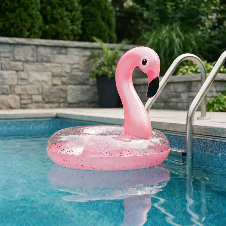 Pink inflatable flamingo pool float for summer fun & relaxation in the water.