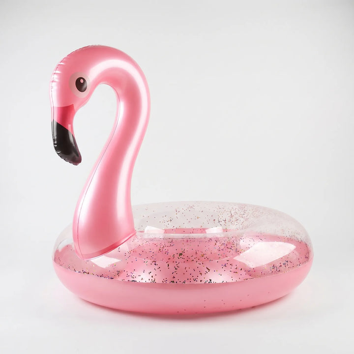 Glittery pink flamingo inflatable pool float, perfect for summer parties & beach vacations.