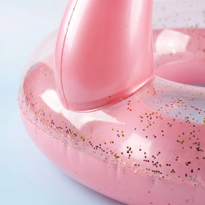 Large pink inflatable flamingo pool float for kids' summer swimming fun & outdoor recreation.