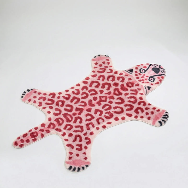Flowique statement area rug featuring a unique pink animal print and playful wave design. Ideal for modern home decor.