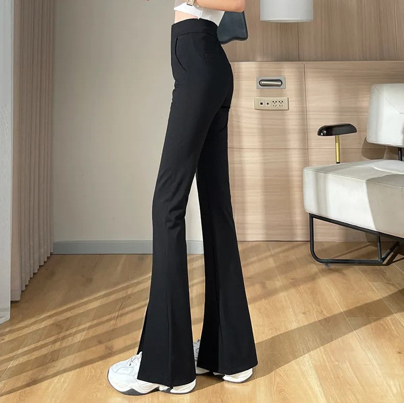 Elegant black plus size flared slit pants for women. High-waisted design for a flattering silhouette.