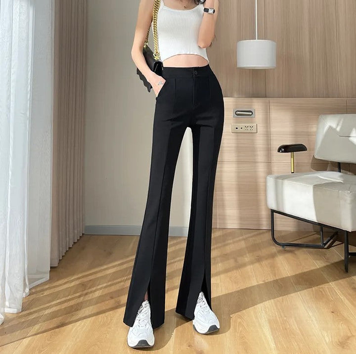 Women's plus size black fashion pants: flared leg with stylish front slits. Comfortable & retro chic.