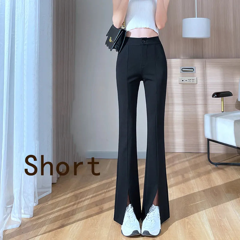 Women's plus size black high waist flared pants featuring chic front leg slits. Versatile & retro style.