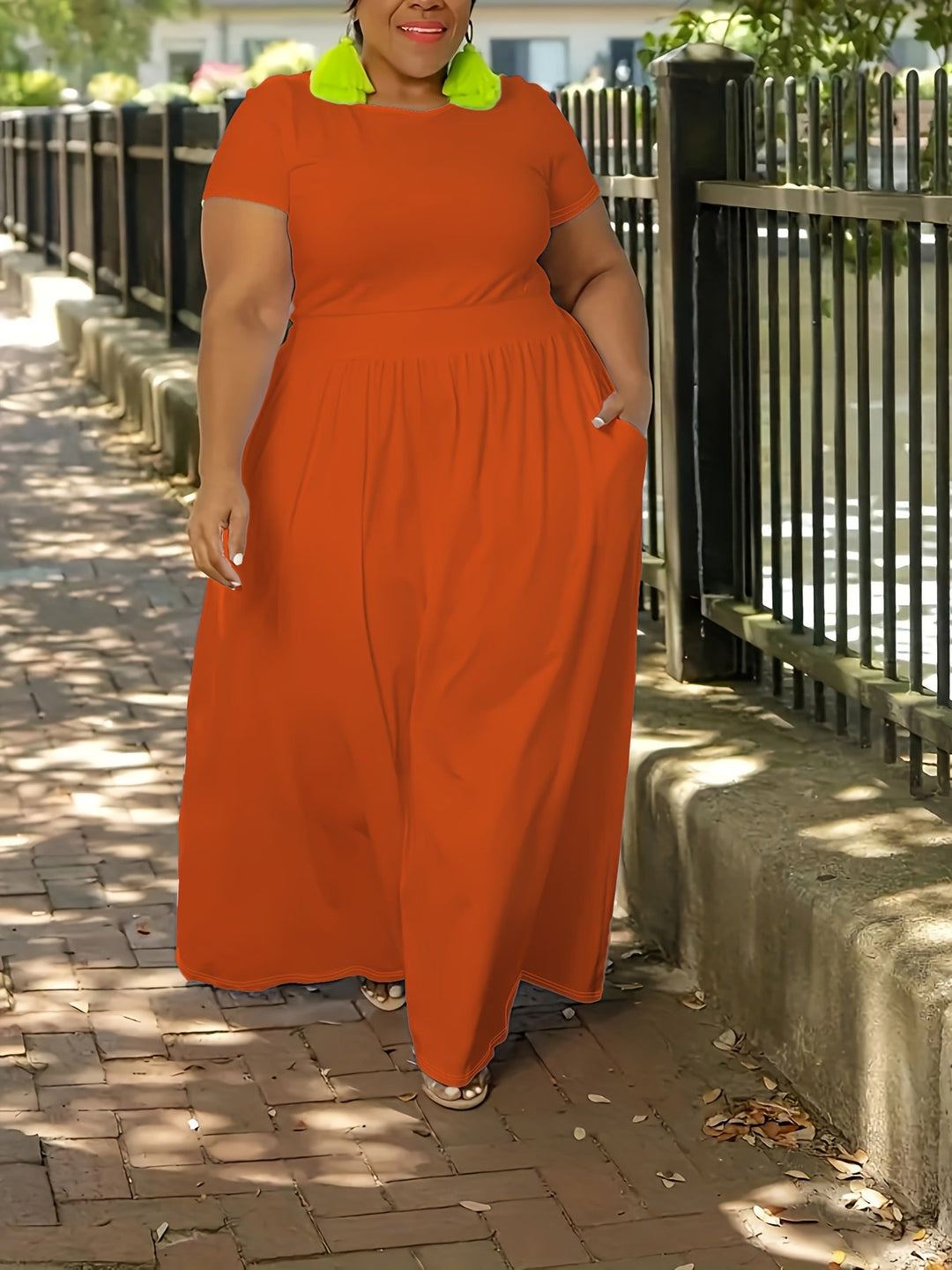 Plus size women's flowy maxi dress with short sleeves & pockets, comfortable summer fashion.