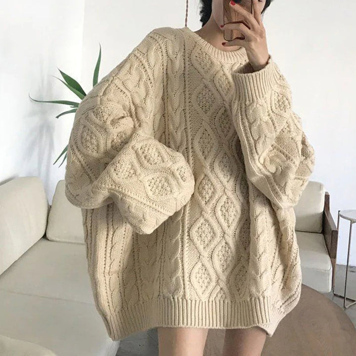 Close-up of a cozy plus size women's oversized sweater, highlighting its soft knit and relaxed winter warmth.
